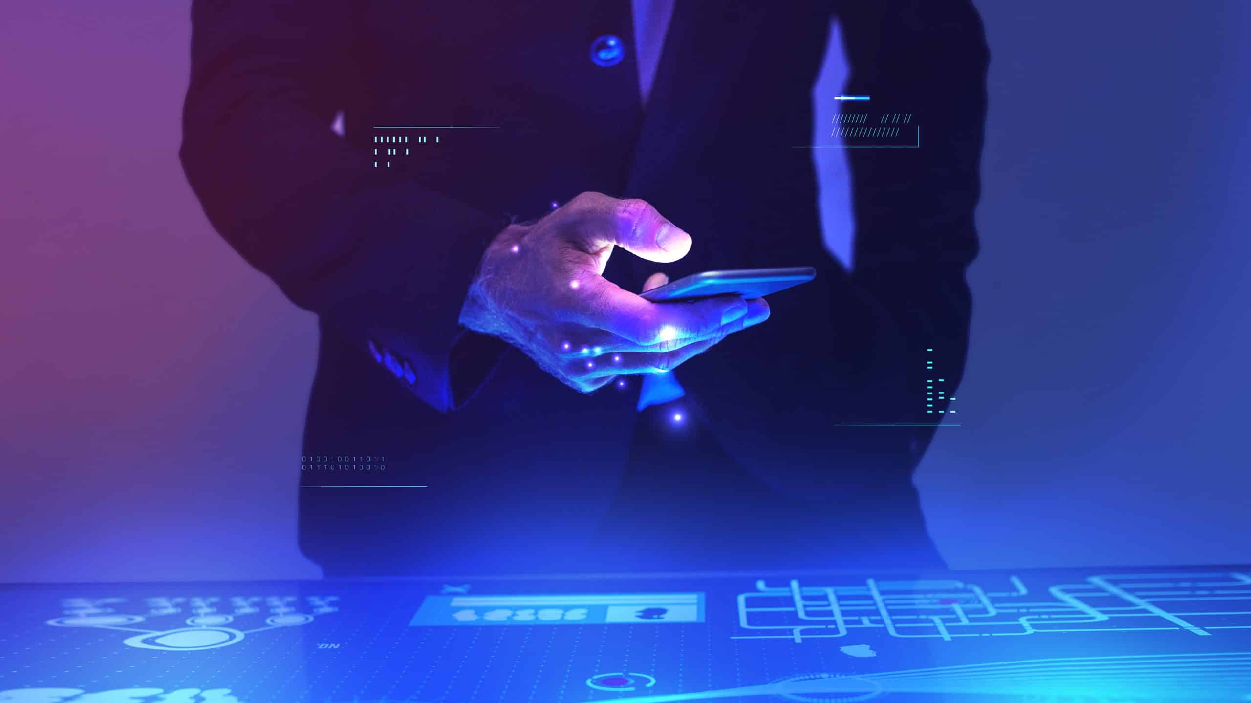 Businessman using his mobile phone for data